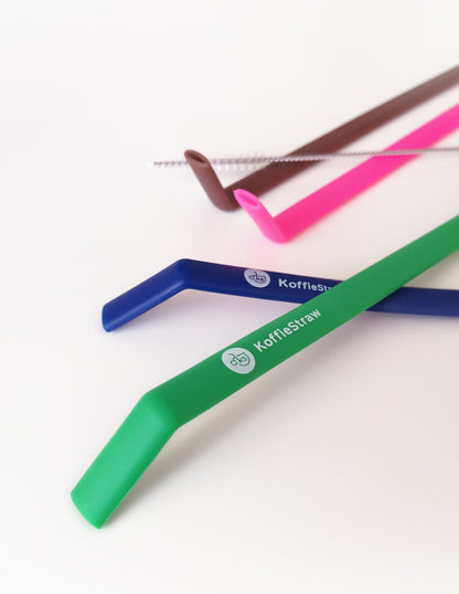 4-Pack of KoffieStraw 8": Green, Mocha, Navy, Pink; and stainless steel cleaning brush in a home compostable packaging